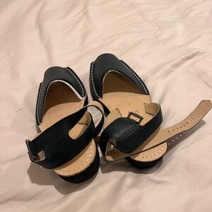 Black Leather Women’s Pons platform sandals.